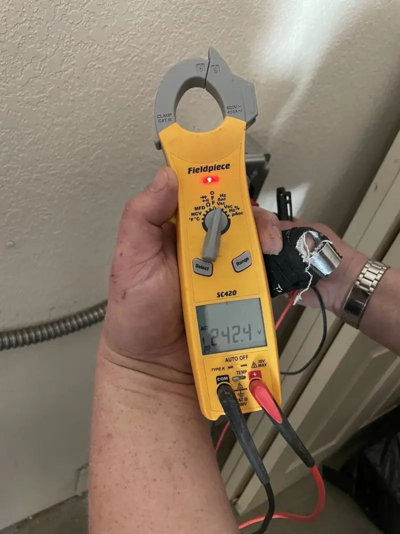 Voltage testing with clamp meter during Aluminum Wiring Replacement in Defiance